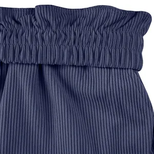 Close-up detail of the elastic pleated waistband on men's corduroy cargo shorts.