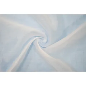 Close-up of light blue semi-transparent chiffon fabric with a soft swirl texture