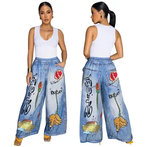 Front and back views of women's graffiti print wide-leg denim pants with heart and rose art