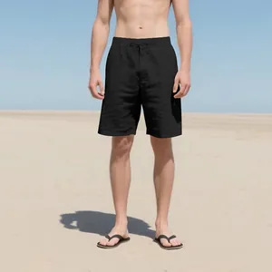 Close-up of men's black linen casual shorts with drawstring waist on beach background