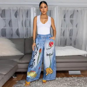 Woman wearing stylish wide-leg printed trousers with artistic graffiti patterns for casual look