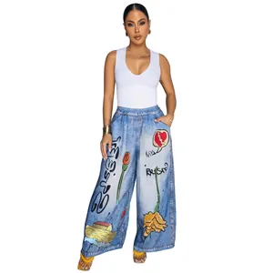 Women's chic wide-leg denim trousers featuring artistic graffiti prints and white tank top