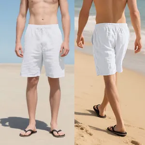 Detailed view of loose men's white linen beach shorts showing front and back fit.