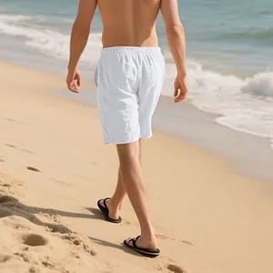 Back view detail of white men's casual linen shorts on a sunny tropical beach scene