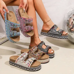 Detail of bohemian platform sandals with colorful beads and rhinestone double buckles.