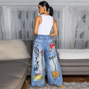 Back view of women's wide-leg pants featuring vibrant graffiti and floral prints