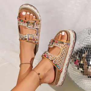 Detail shot of colorful beaded platform sandals with rhinestones and double buckles.