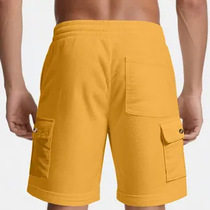 Back view detail of men's yellow corduroy cargo shorts with buttoned pockets