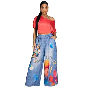 Close-up detail of women's high-waist wide-leg pants with vibrant butterfly prints