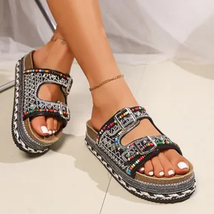Detailed view of bohemian platform sandals featuring colorful beads and shiny rhinestones