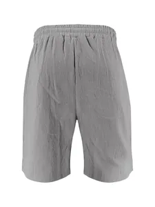 Macro view of the elastic waistband and linen texture on gray men's shorts
