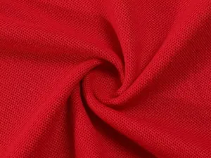 Close-up macro shot of breathable red mesh fabric texture for polo shirt details