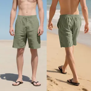 Front and back views of men's breathable olive green linen beach shorts on a model