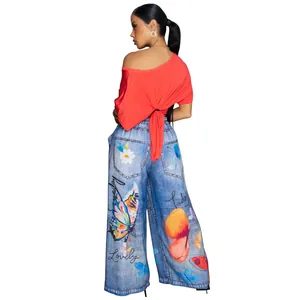 Back view of stylish women's wide-leg trousers featuring colorful butterfly and floral prints