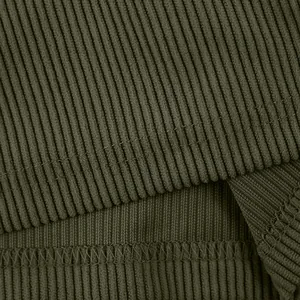 High-quality close-up macro detail of olive green ribbed corduroy fabric and stitching