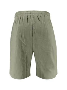 Professional back view of men's loose linen shorts in sage green with elastic waistband
