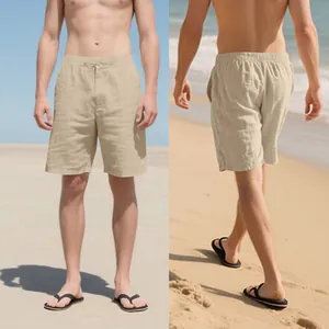Detailed view showing both front and back angles of beige linen shorts in beach setting