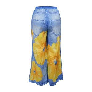 Back view of high-waist wide-leg trousers with denim print and yellow sunflowers