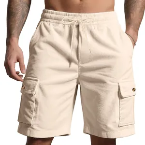 Close-up of beige corduroy cargo shorts with drawstring waist and side pockets.