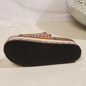 Detail view of bohemian platform slide sandal with rhinestones and colorful beads