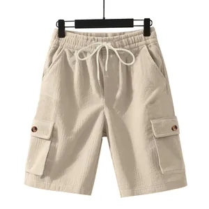 Beige men's loose fit corduroy cargo shorts with drawstring waist and pockets