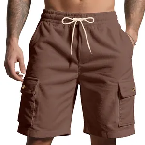 Detail of men's brown corduroy cargo shorts featuring side pockets and drawstring