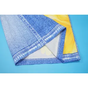 Close-up detail of hem stitching on floral faux denim printed wide-leg pants.
