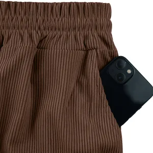 Detail view of the deep side pocket and rich corduroy fabric of brown men's casual shorts