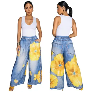 Stylish wide-leg pants with denim texture and large yellow floral print for women.
