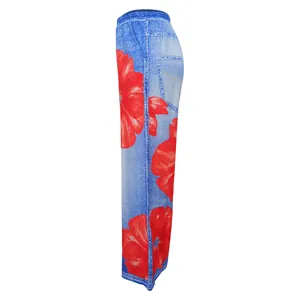 Side view of blue denim-print wide-leg pants with large red floral pattern