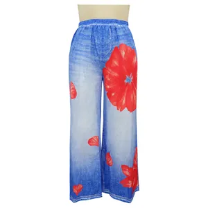 Front view detail of casual floral printed wide leg trousers with denim texture effect