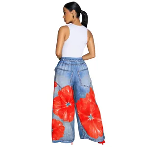 Detailed back view of women's floral print wide-leg pants paired with white tank top.