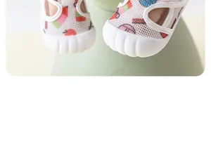 Detailed macro view showing breathable mesh fabric and protective white rubber toe cap on baby sandals