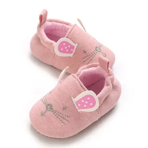 Close-up of pink cartoon mouse baby floor socks with soft soles for indoor use