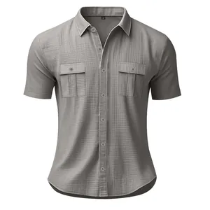 Close-up detail view of a grey men's short-sleeved linen shirt with chest pockets
