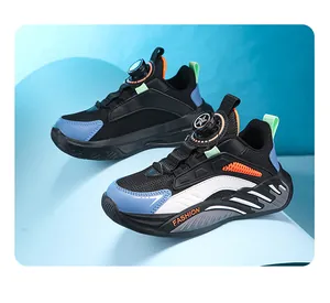 Close-up detailed view of boys' breathable mesh sneakers with convenient rotary knob buckle