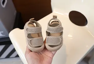 Detailed view of breathable khaki mesh baby sandals featuring flexible soft rubber soles