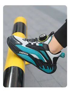 Side view of boys breathable mesh running shoe with adjustable quick lace knob