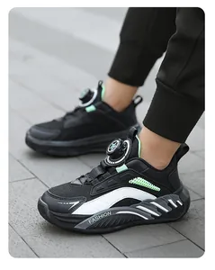 Close-up of boys' black mesh sports shoes with rotary buckle and fashion sole