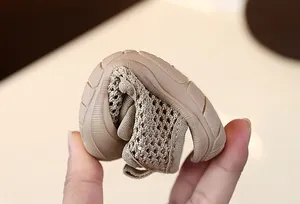 Detailed macro view showing the flexible soft sole of a breathable mesh baby sandal