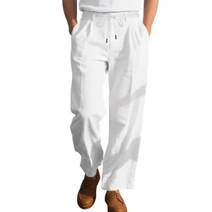 Men's loose white linen trousers featuring a pleated front and drawstring waist