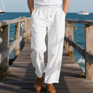 Breathable men's white linen trousers in loose Naples style worn on a sunny wooden pier