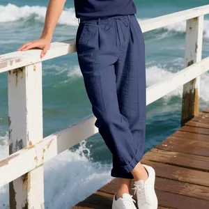 Detailed shot of men's navy blue loose linen casual straight trousers with drawstring