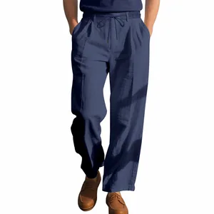 Close-up view of men's loose blue linen trousers featuring a comfortable drawstring waist