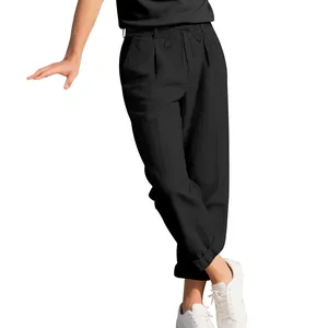 Detail of men's loose casual straight-leg linen trousers in breathable black fabric.