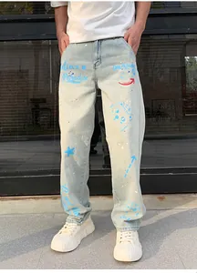 Light blue men's straight-leg jeans featuring vibrant blue and red graffiti prints.