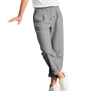 Detail view of grey men's loose casual straight-leg linen pants with drawstring waist