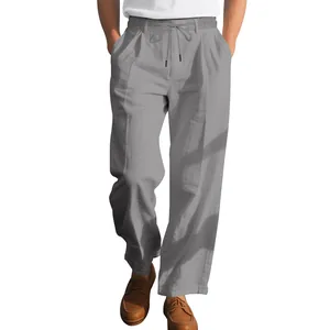 Detailed view of men's loose gray linen straight trousers with drawstring waist.