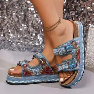 Detailed close-up view of bohemian platform sandals with intricate beadwork and rhinestones