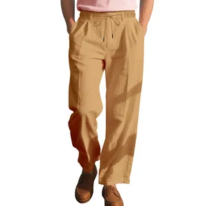 Detailed view of men's loose linen straight-leg casual trousers in tan color for summer.
